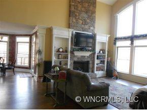 990 Oak Springs Road Rutherfordton, NC 28139 - Photo 5 of 14 a living room with furniture a flat screen tv and a fireplace
