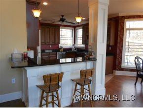 990 Oak Springs Road Rutherfordton, NC 28139 - Photo 8 of 14 a kitchen with dining table and chairs