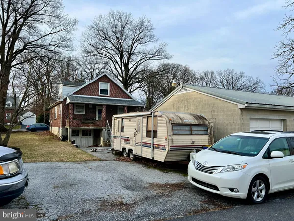 a car parked in front of a house