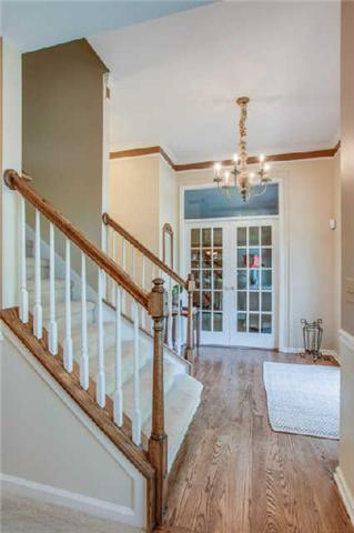 Gorgeous entry with updated lighting*Exquisite hardwoods in main living areas!