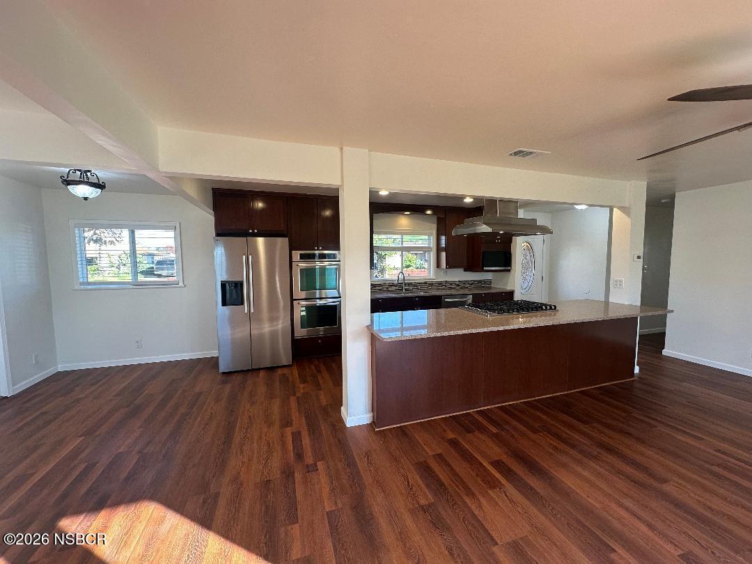 319 South B Street Lompoc, CA 93436 - Photo 11 of 19 a view of kitchen with sink and wooden floor