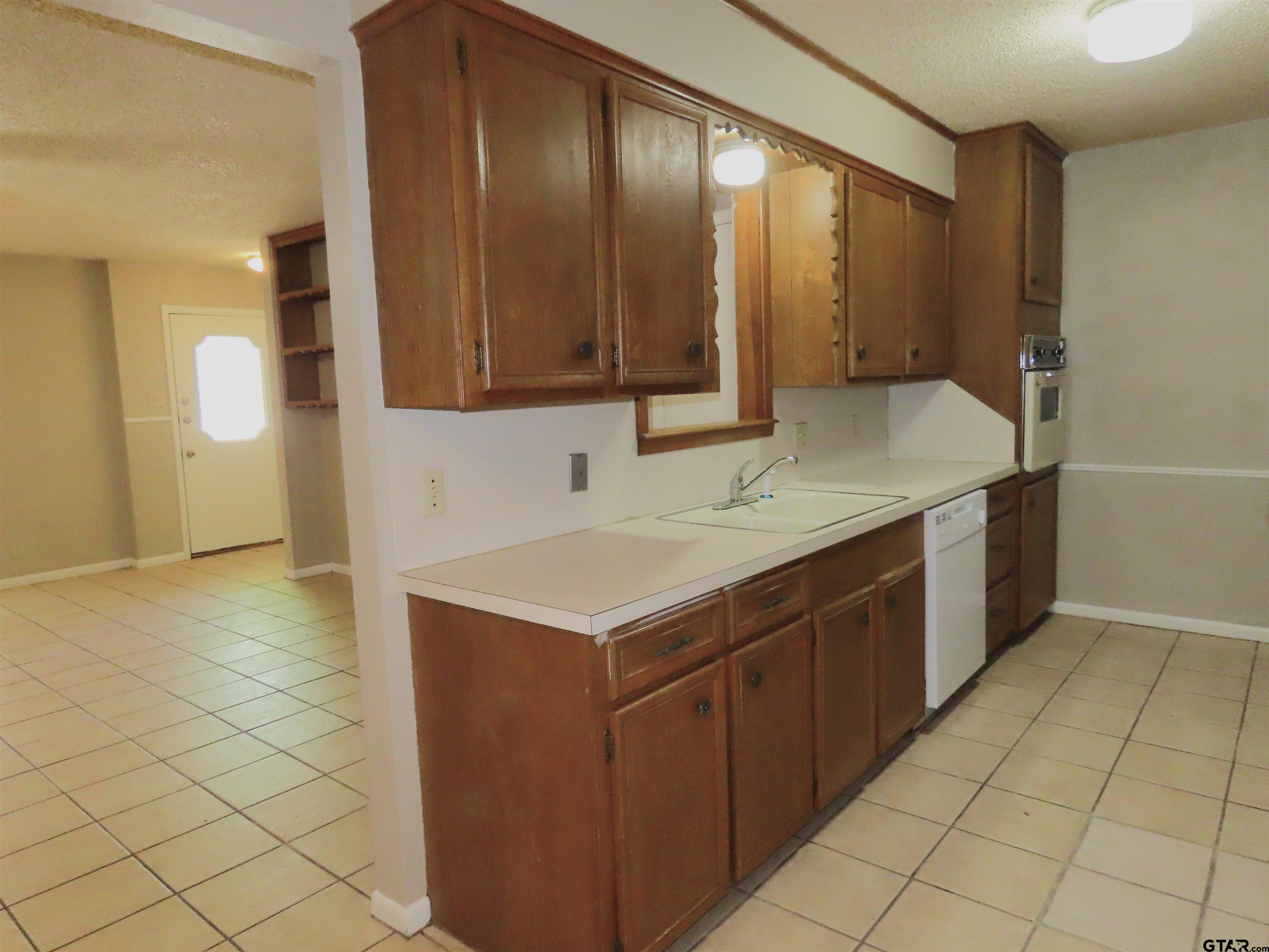 402 Muller Garden Road Tyler, TX 75703 - Photo 10 of 33 a bathroom with a sink and a mirror