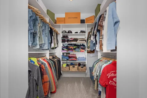 a view of storage and utility room with washer and dryer