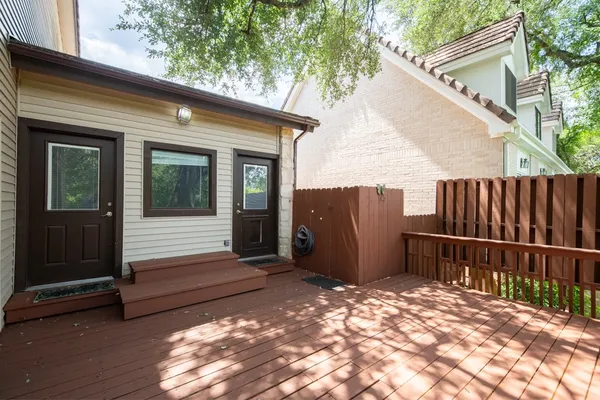 a view of a wooden door with a big yard