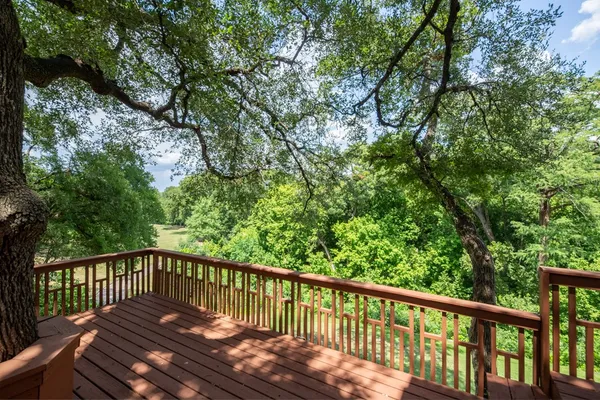 a view of balcony with wooden floor