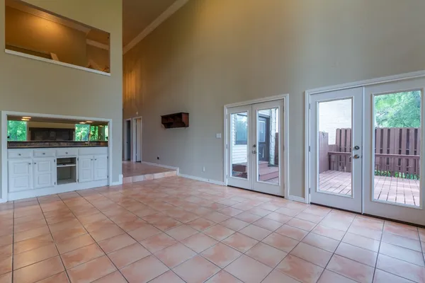 a view of a livingroom with a fireplace and window