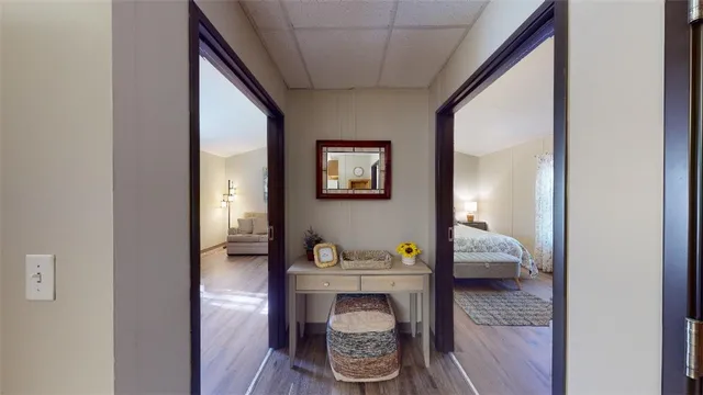 a bedroom with a bed and a mirror