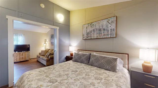 a bedroom with a bed and a couch