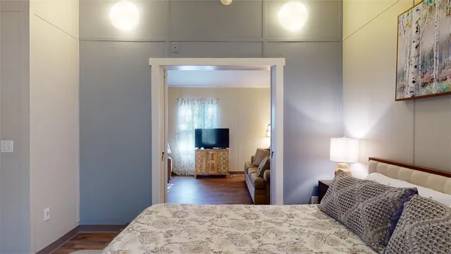 a bedroom with a bed and a couch