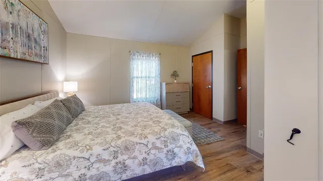 a bedroom with a bed and a television