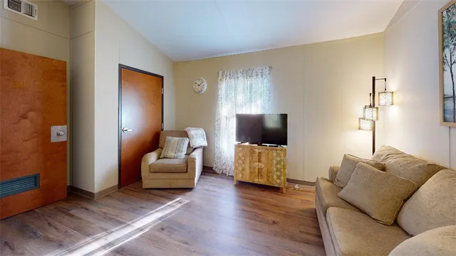 a bedroom with a bed and a couch