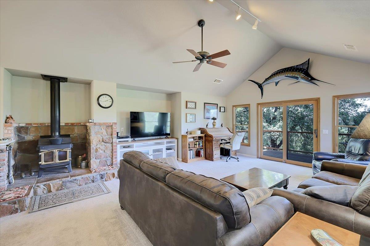 9521 Sicard Flat Road Browns Valley, CA 95918 - Photo 13 of 83 a living room with furniture ceiling fan and a flat screen tv