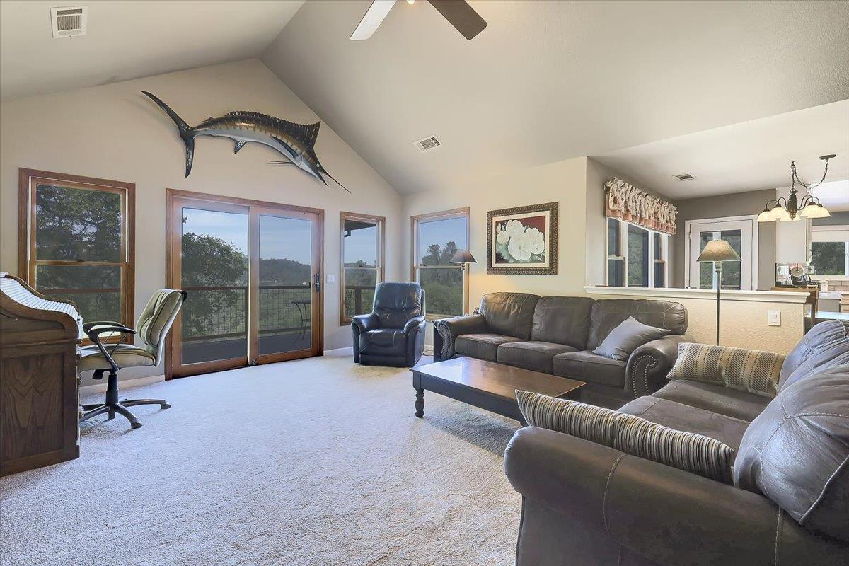 9521 Sicard Flat Road Browns Valley, CA 95918 - Photo 15 of 83 a living room with furniture floor to ceiling window and a flat screen tv