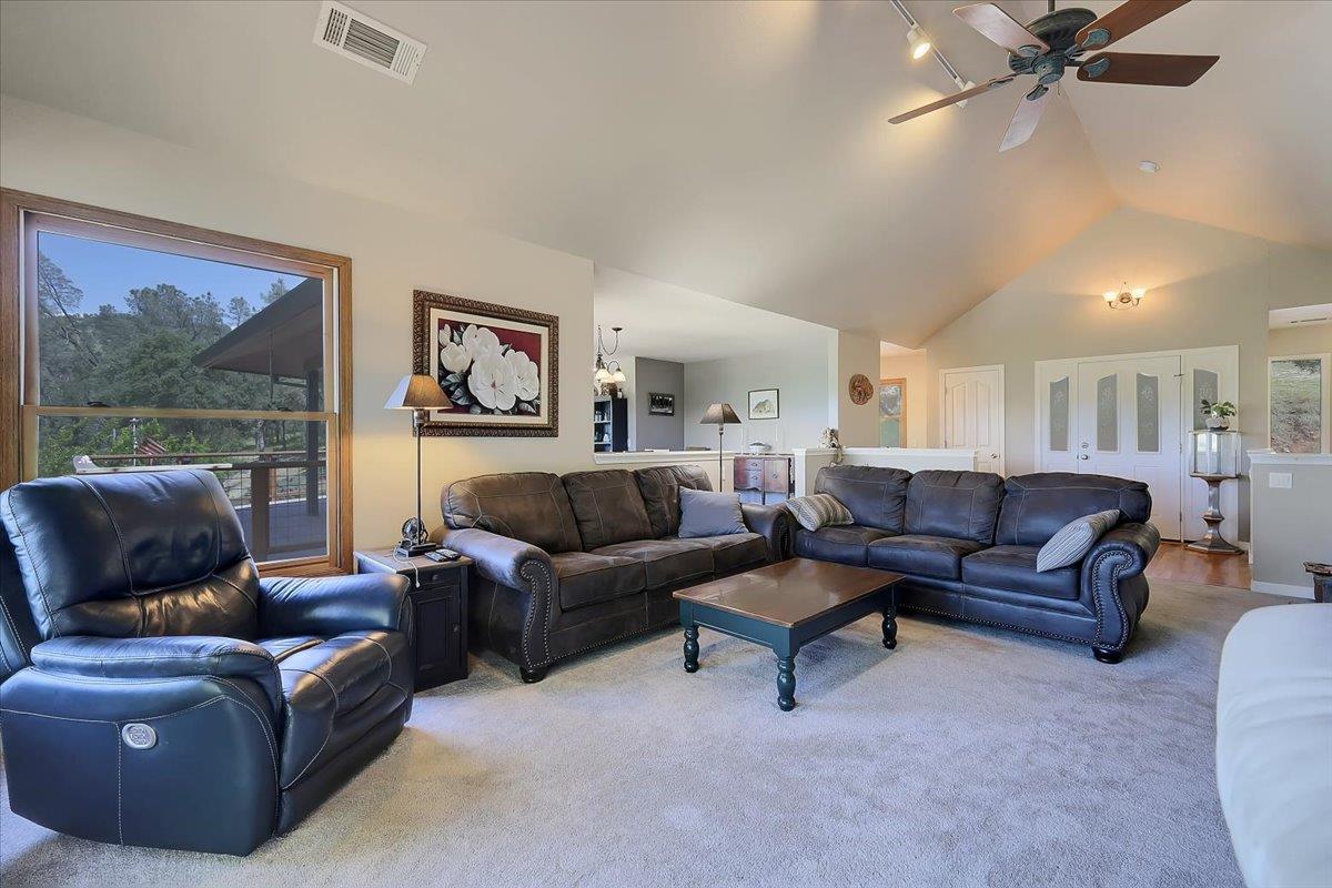 9521 Sicard Flat Road Browns Valley, CA 95918 - Photo 16 of 83 a living room with furniture and a painting on the wall