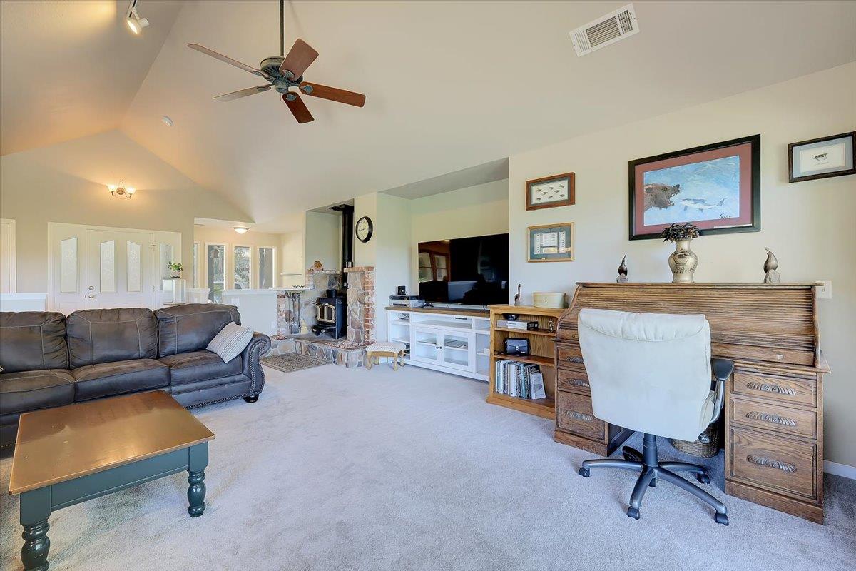9521 Sicard Flat Road Browns Valley, CA 95918 - Photo 17 of 83 a living room with furniture and a flat screen tv