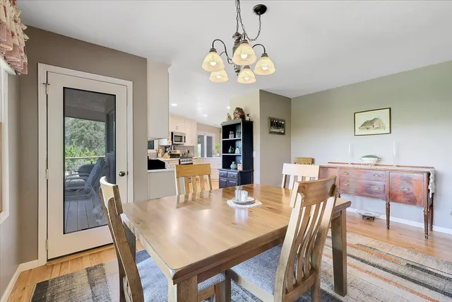a kitchen with granite countertop stainless steel appliances a refrigerator and cabinets