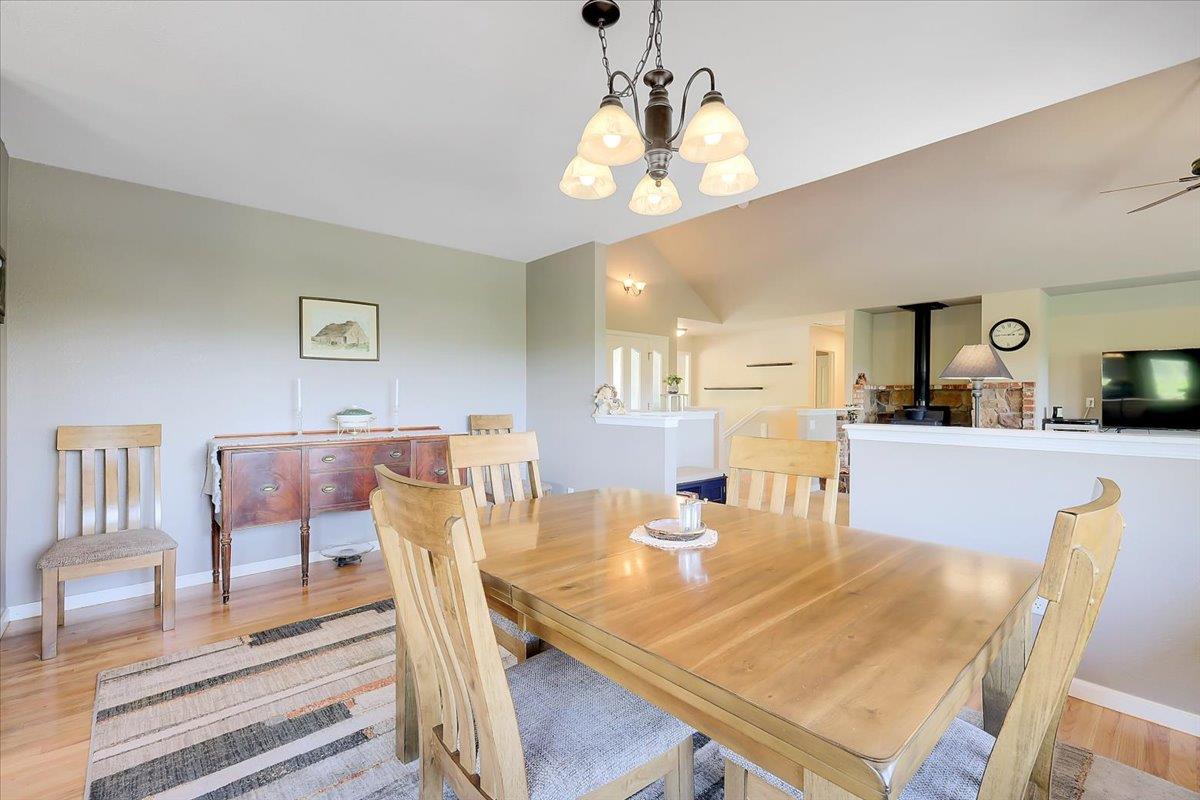 9521 Sicard Flat Road Browns Valley, CA 95918 - Photo 21 of 83 a view of a dining room with furniture and wooden floor