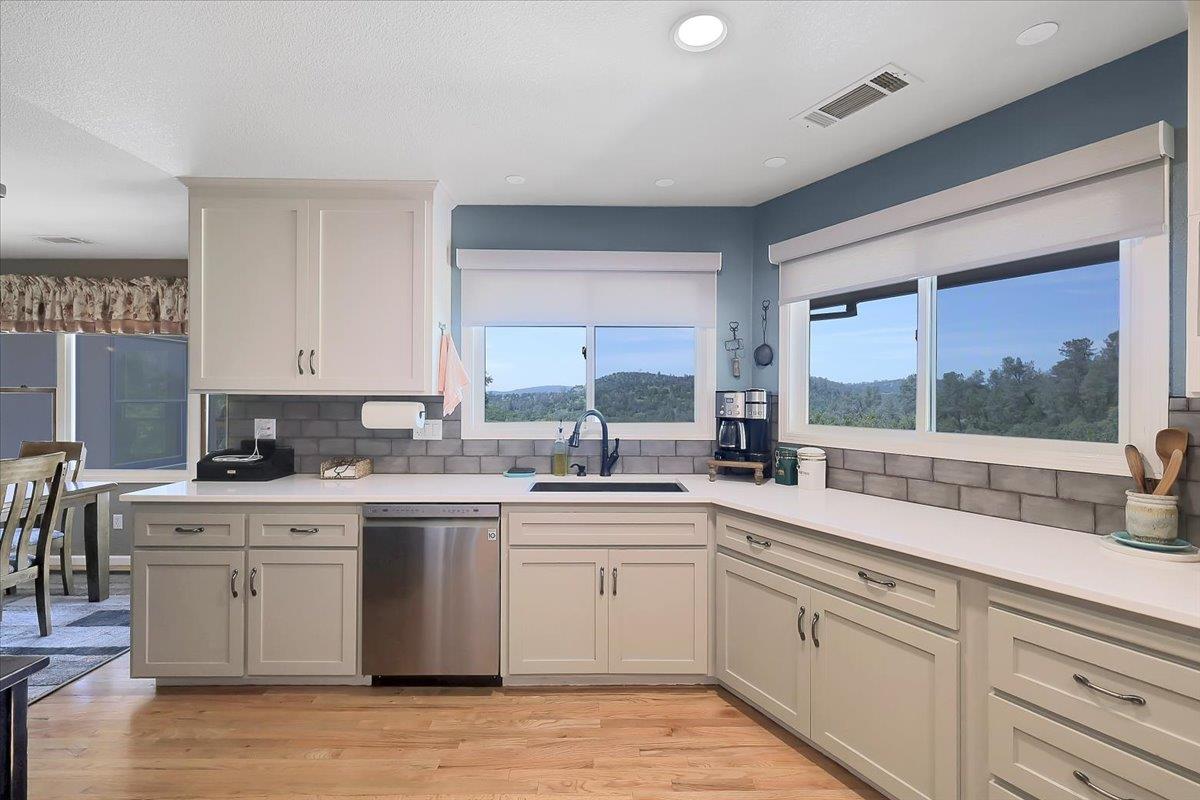 9521 Sicard Flat Road Browns Valley, CA 95918 - Photo 24 of 83 a kitchen with a sink stove and cabinets