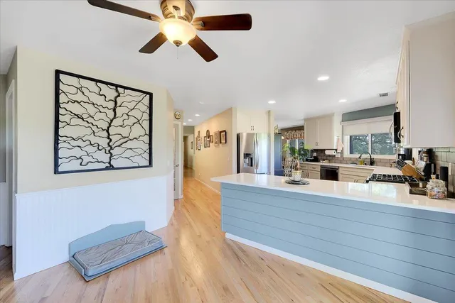 a bathroom with a bathtub shower sink and mirror