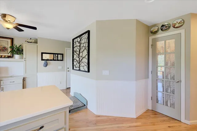 a spacious bedroom with a bed and a large window