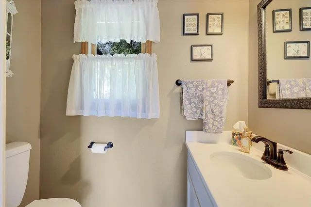 a bathroom with a sink a vanity and mirror