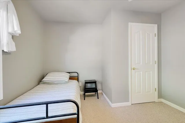 a bedroom with a bed and a cabinets