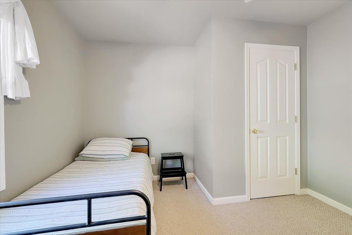 9521 Sicard Flat Road Browns Valley, CA 95918 - Photo 36 of 83 a room with a chair and wooden floor