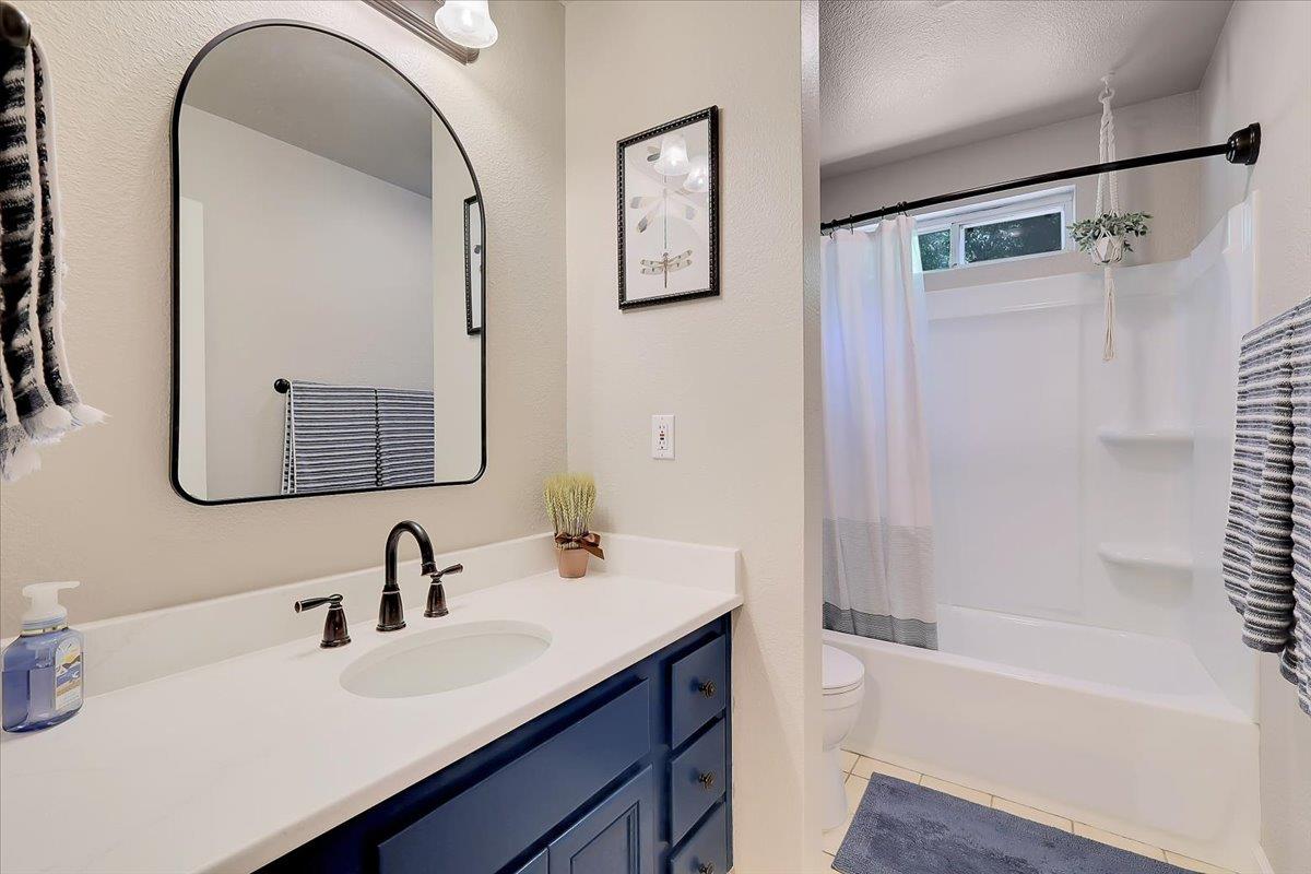 9521 Sicard Flat Road Browns Valley, CA 95918 - Photo 37 of 83 a bathroom with a bathtub shower sink and mirror