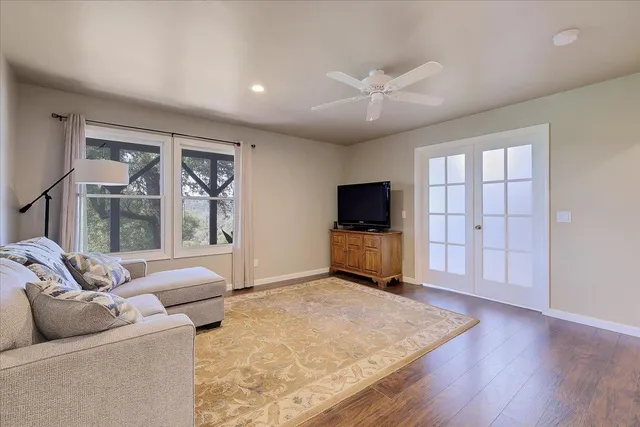 a view of balcony with wooden floor and fence