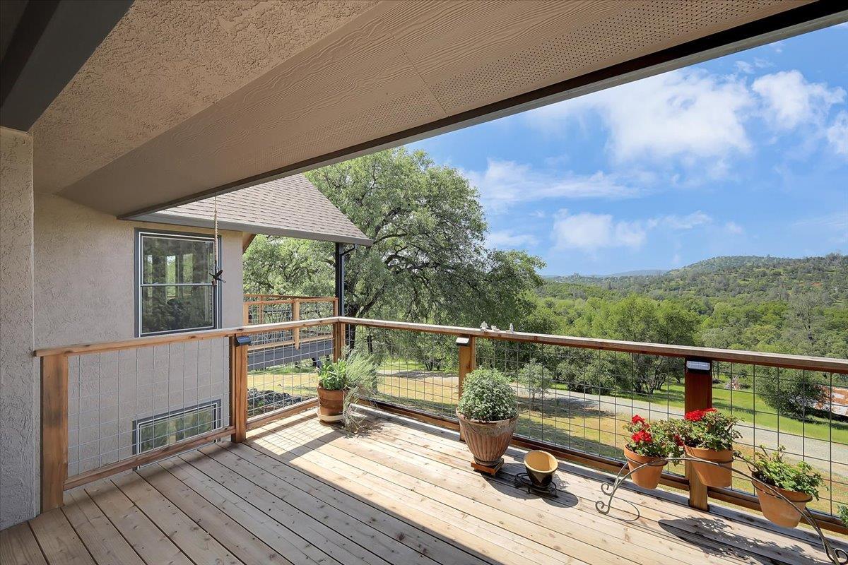 9521 Sicard Flat Road Browns Valley, CA 95918 - Photo 62 of 83 a view of roof deck with wooden floor and furniture