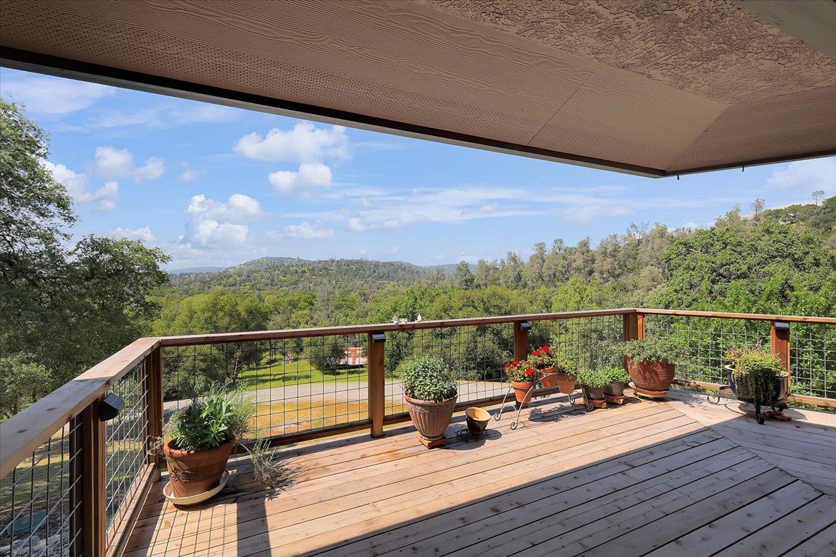 9521 Sicard Flat Road Browns Valley, CA 95918 - Photo 63 of 83 a view of a balcony with wooden floor and outdoor seating