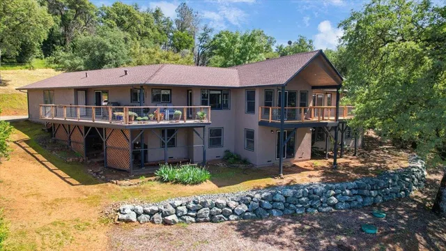a living room with furniture ceiling fan and a flat screen tv