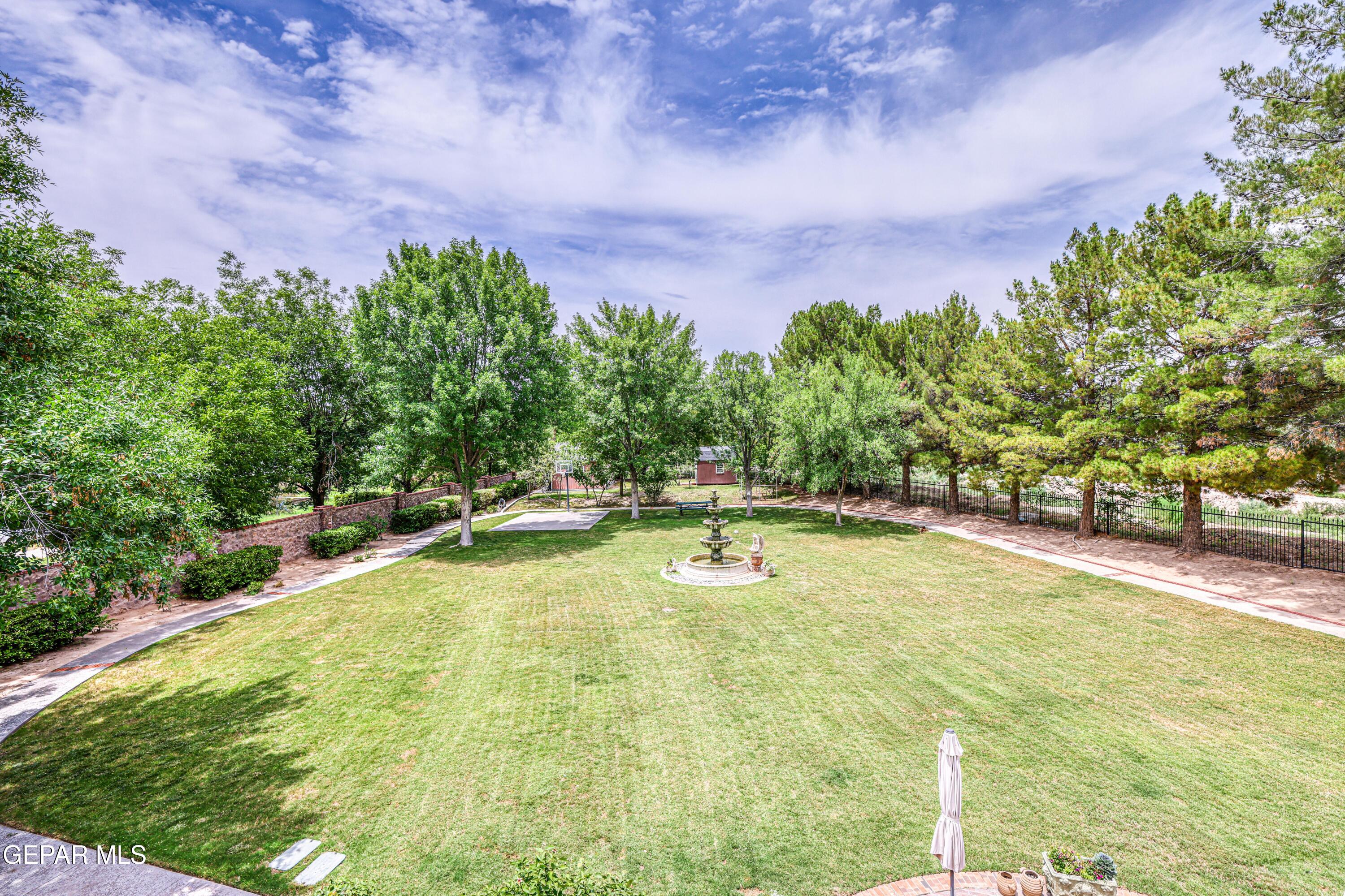 501 Country Club Road El Paso, TX 79932 - Photo 87 of 88 a view of a swimming pool with an outdoor space and seating area