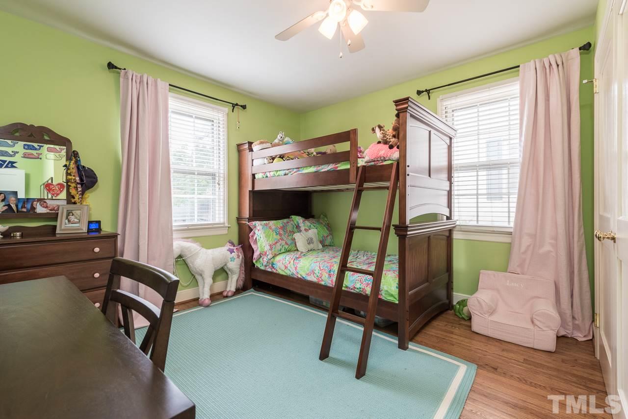 1205 Mitchell Street Raleigh, NC 27607 - Photo 9 of 25 a bedroom with furniture and a window