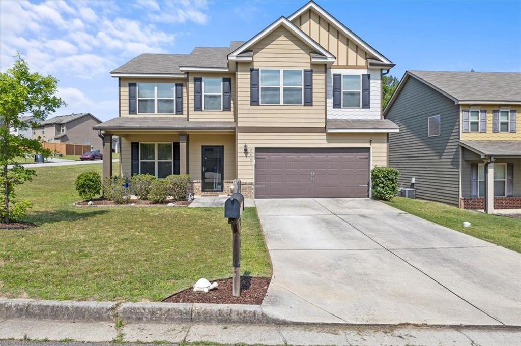 a front view of a house with garden