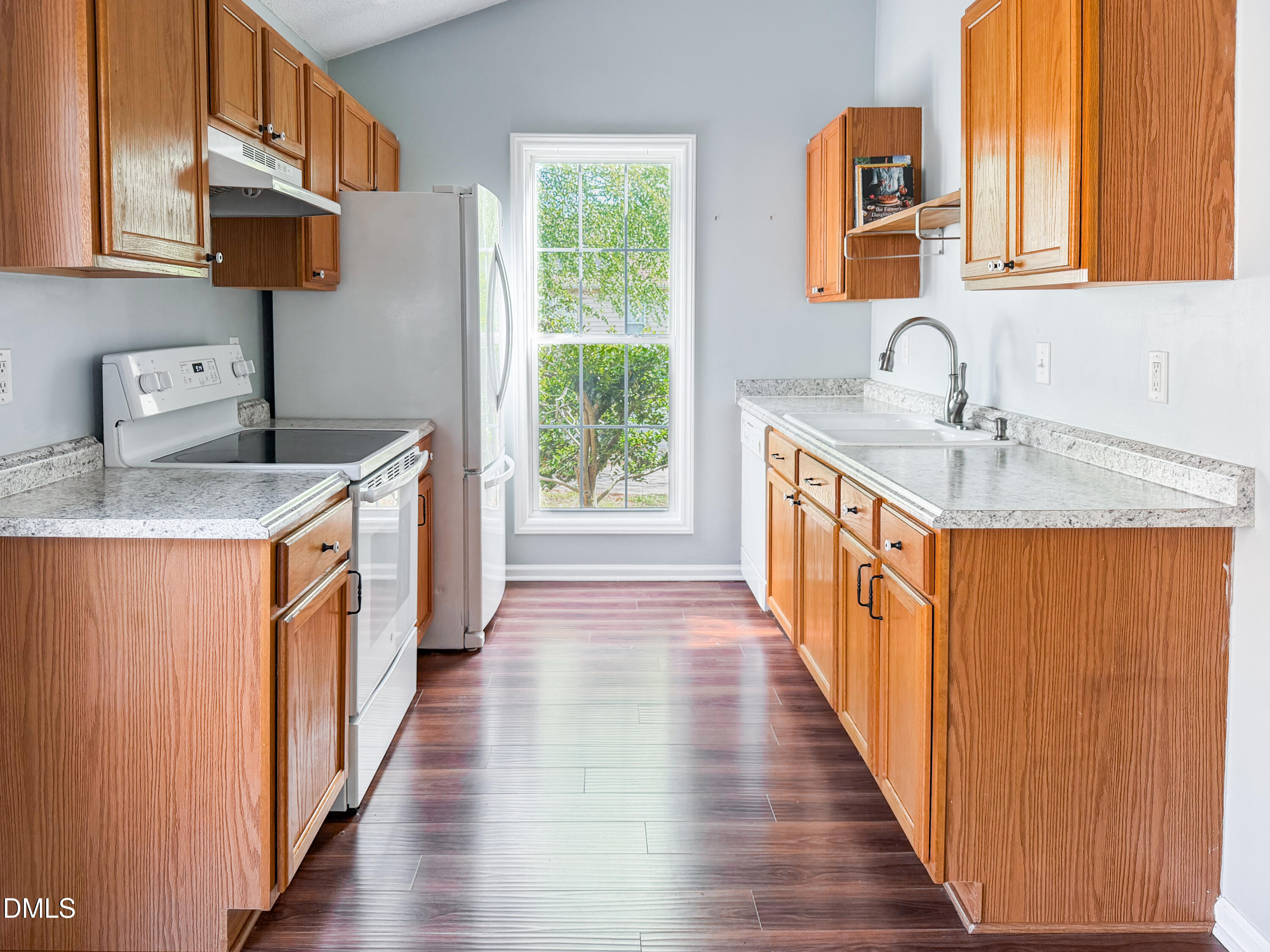 6304 Forest Ridge Drive Durham, NC 27713 - Photo 8 of 29 a kitchen with stainless steel appliances granite countertop a sink stove and cabinets