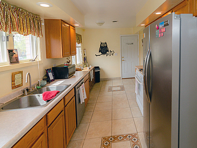 1550 South Pointe Drive Rantoul, IL 61866 - Photo 12 of 54 a kitchen with stainless steel appliances granite countertop a sink and a refrigerator