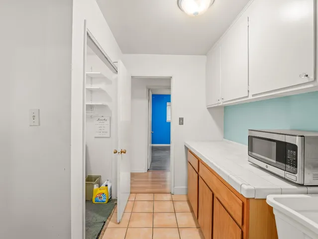 a kitchen with a sink and cabinets