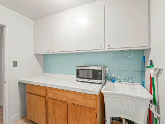 a kitchen with a sink and cabinets