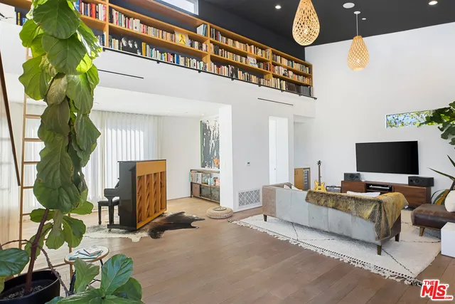 a view of an entryway and livingroom with furniture