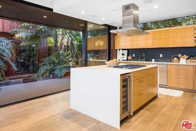 a kitchen with a stove a sink and a refrigerator