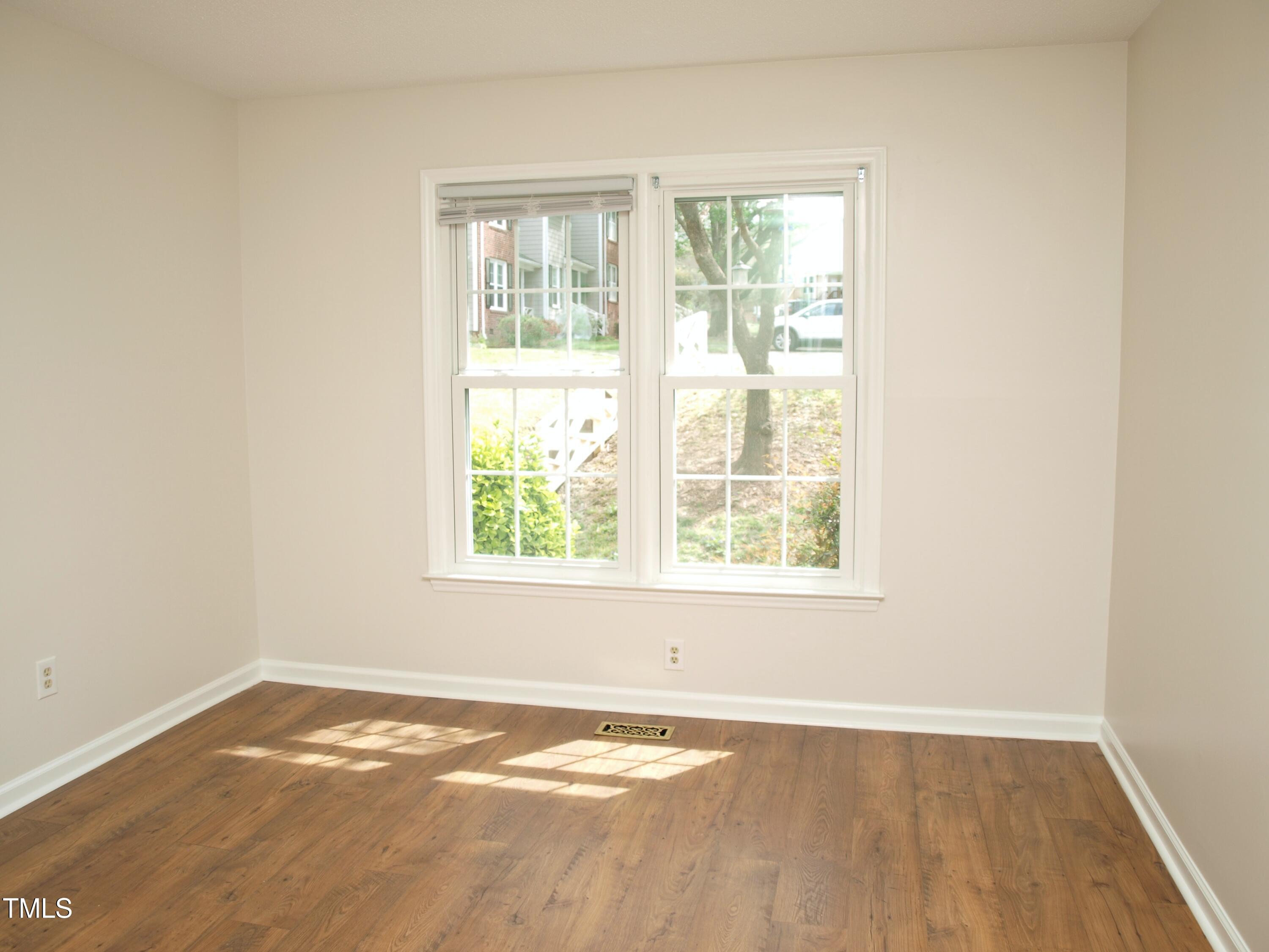 7429 Ashbury Court Raleigh, NC 27615 - Photo 11 of 16 an empty room with a window
