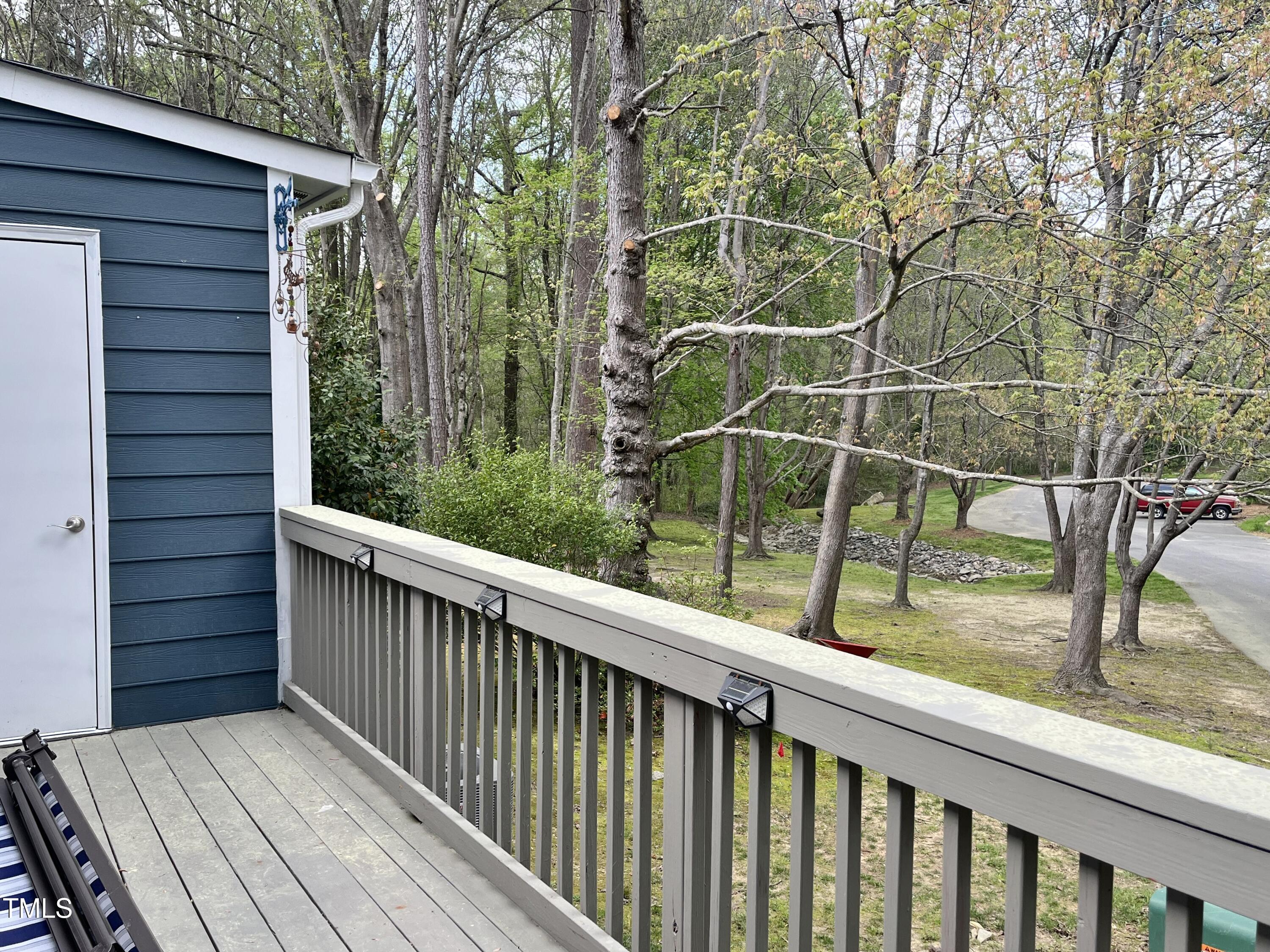 7429 Ashbury Court Raleigh, NC 27615 - Photo 13 of 16 a view of a wooden balcony with mountain view