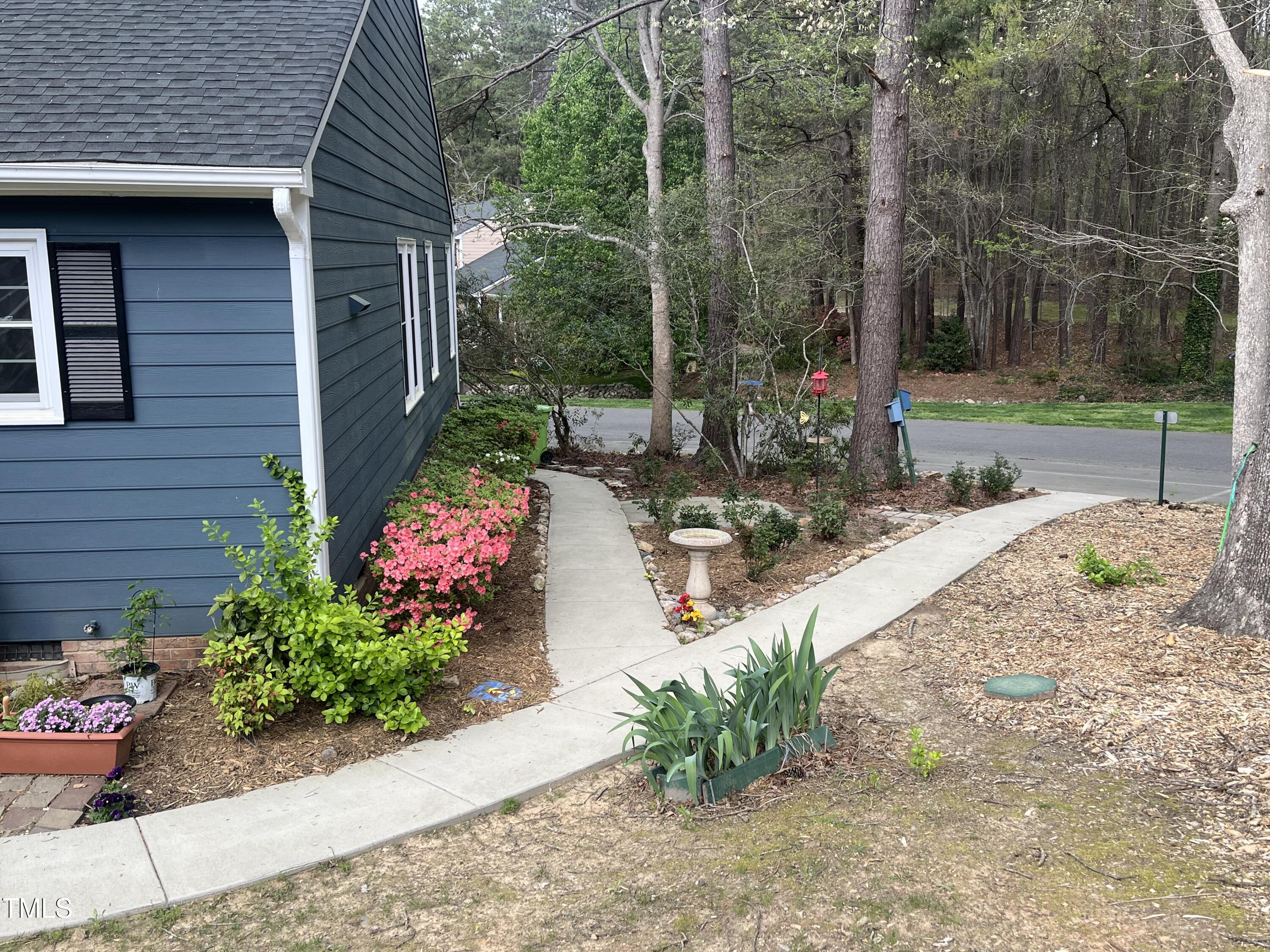 7429 Ashbury Court Raleigh, NC 27615 - Photo 14 of 16 a view of a backyard with sitting area