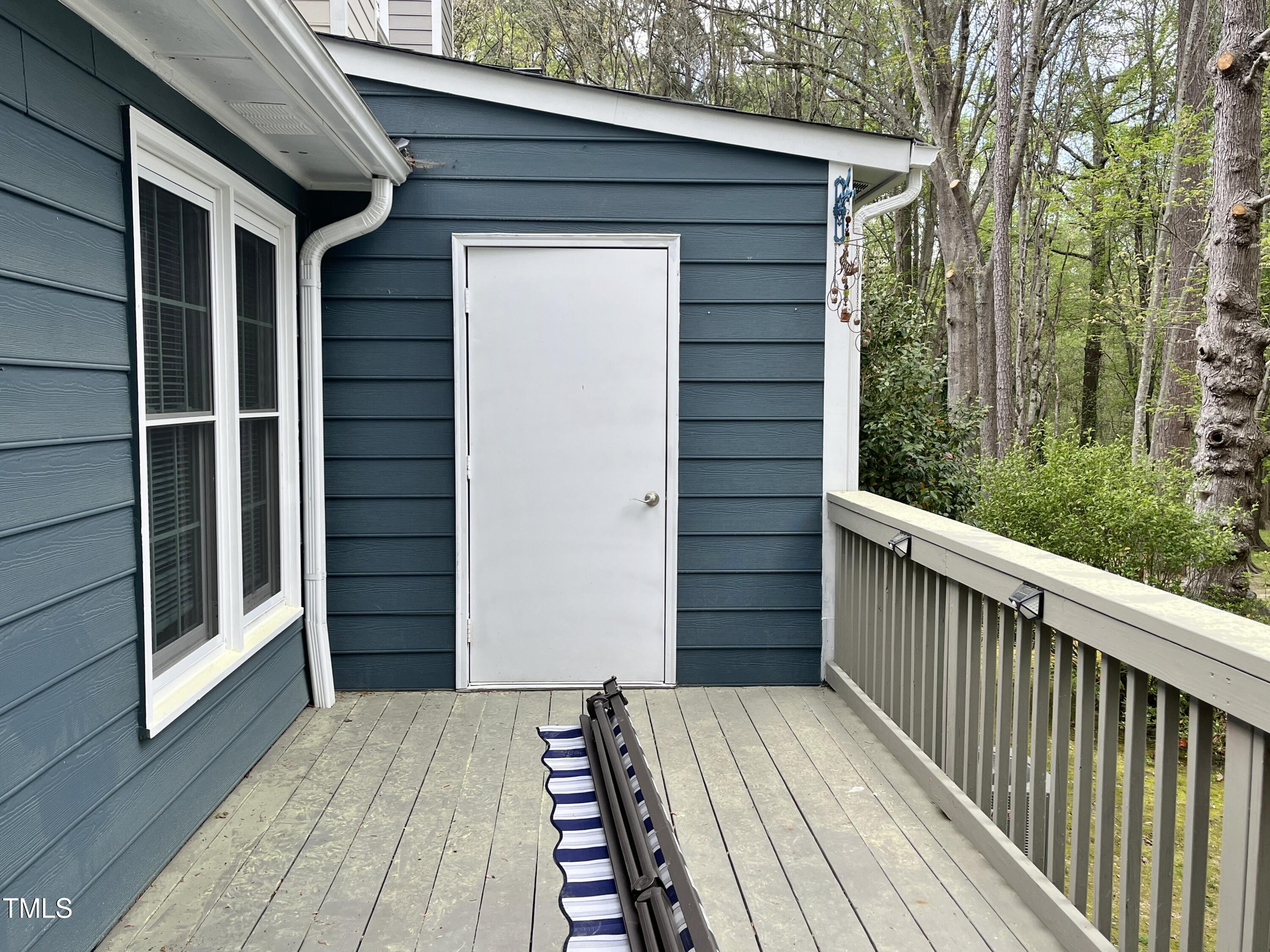 7429 Ashbury Court Raleigh, NC 27615 - Photo 16 of 16 a view of a wooden house with a large window