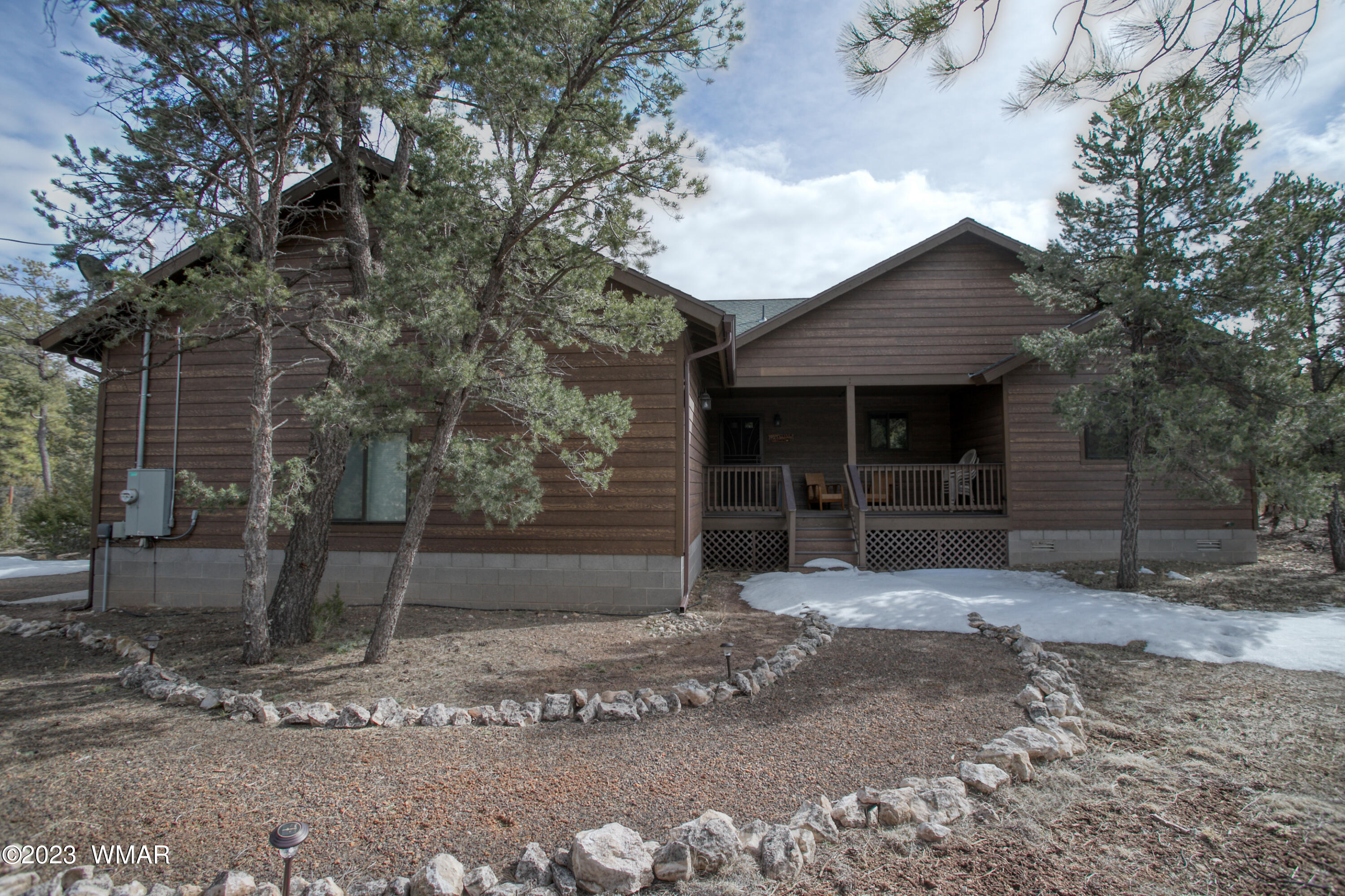 1979 Rim View Lane Heber, AZ 85928 - Photo 1 of 27 a front view of a house with a yard and garage