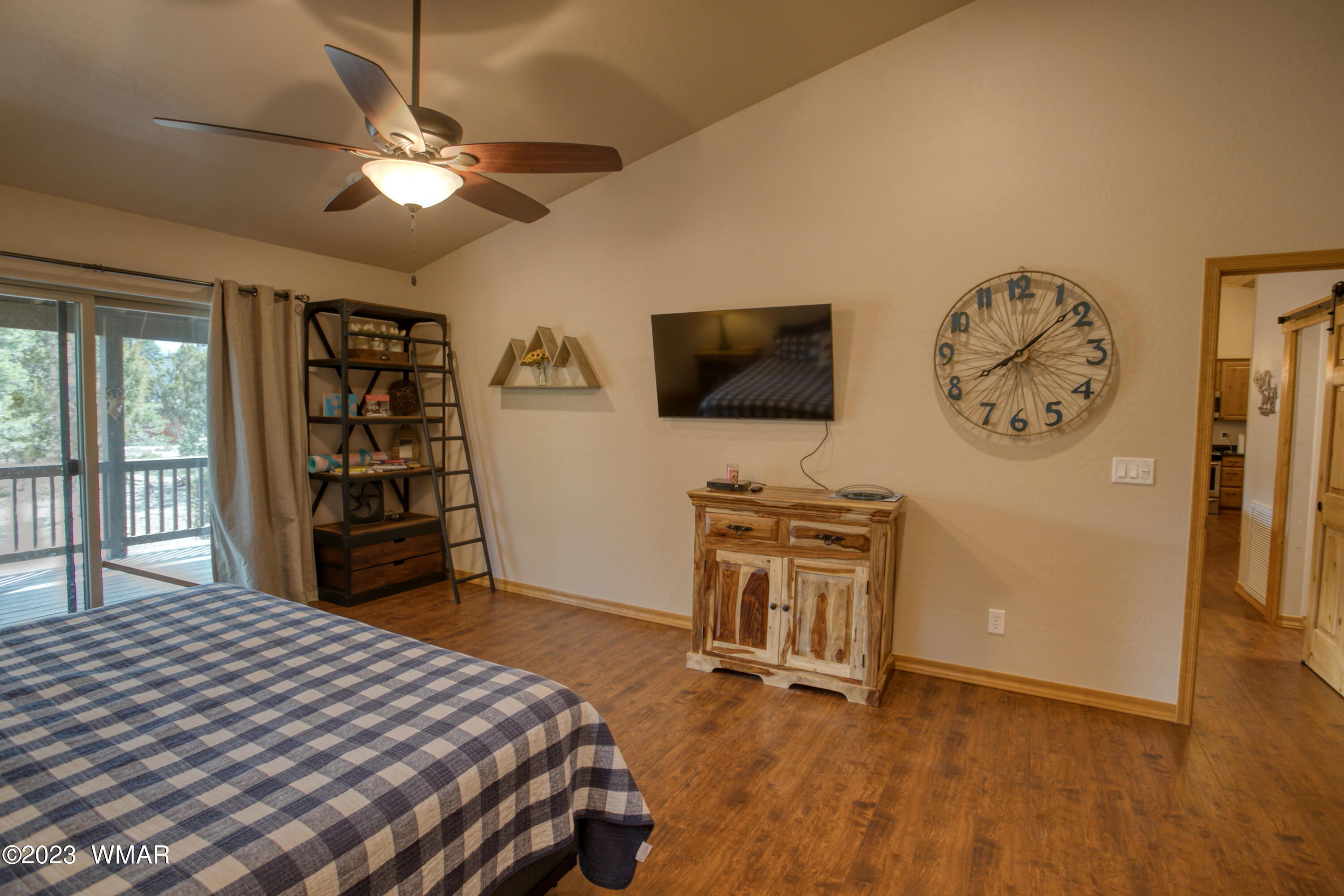 1979 Rim View Lane Heber, AZ 85928 - Photo 11 of 27 a bedroom with a bed and a flat screen tv