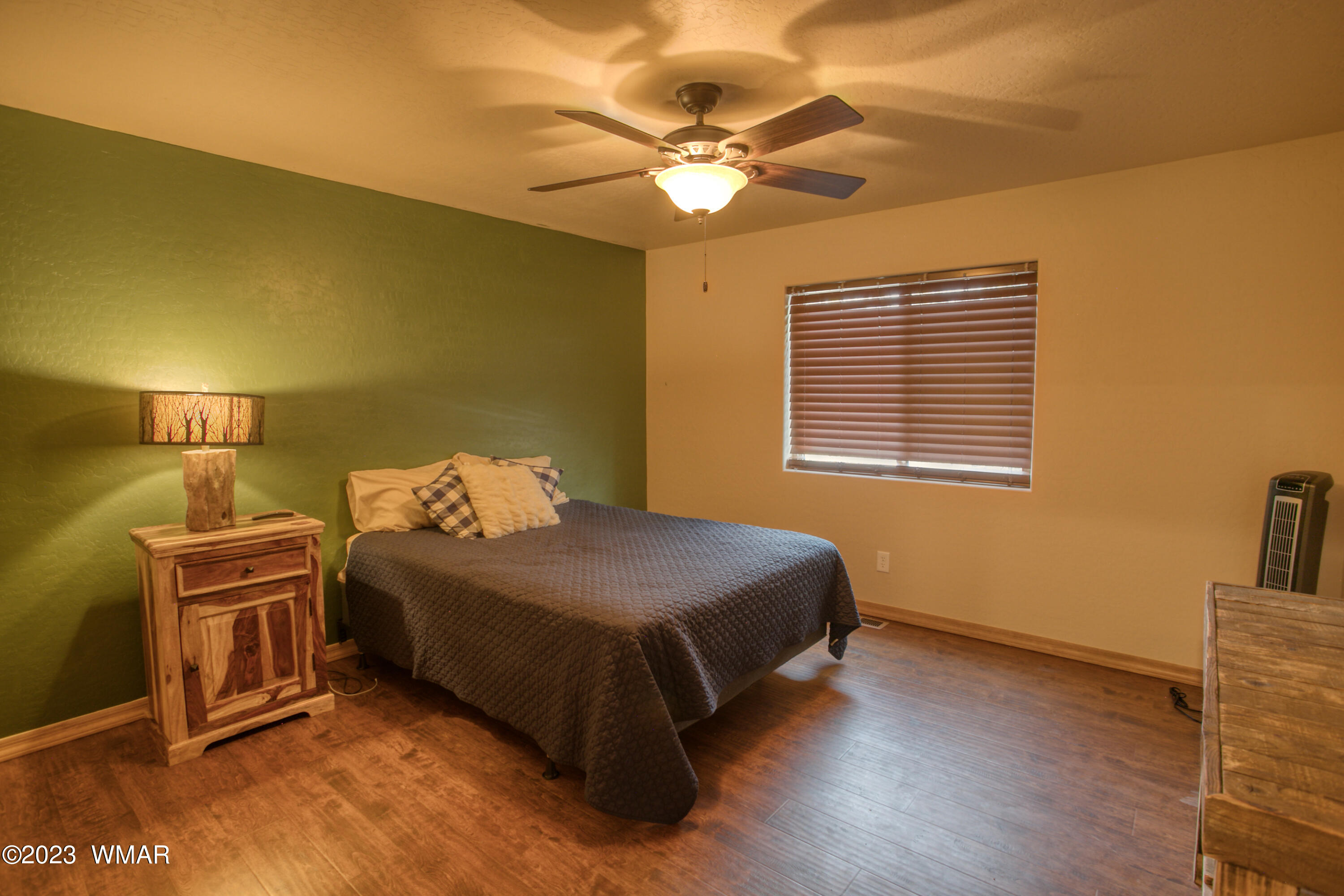 1979 Rim View Lane Heber, AZ 85928 - Photo 13 of 27 a bed room with a bed and a ceiling fan