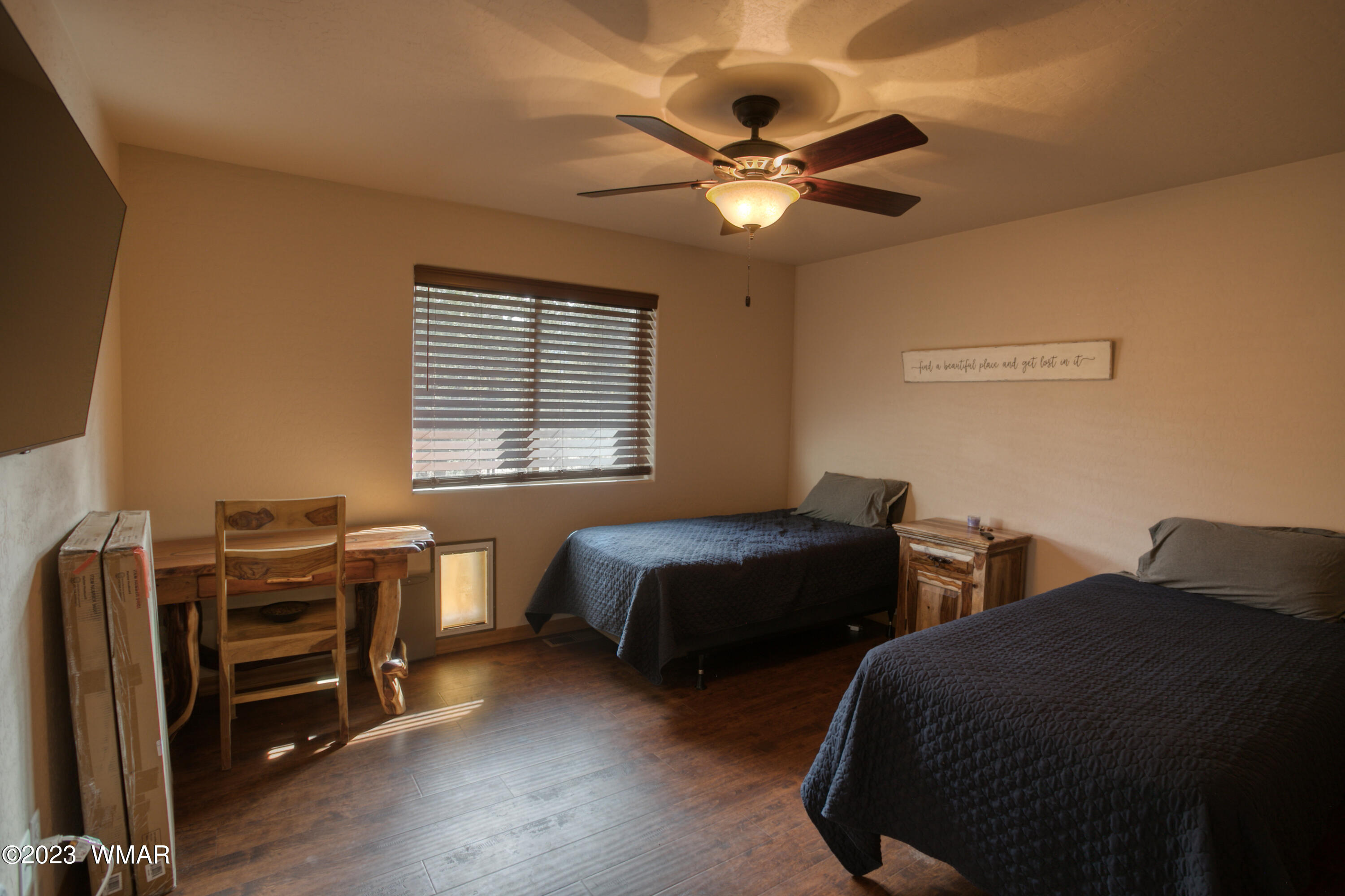 1979 Rim View Lane Heber, AZ 85928 - Photo 16 of 27 a bedroom with two beds and a chandelier