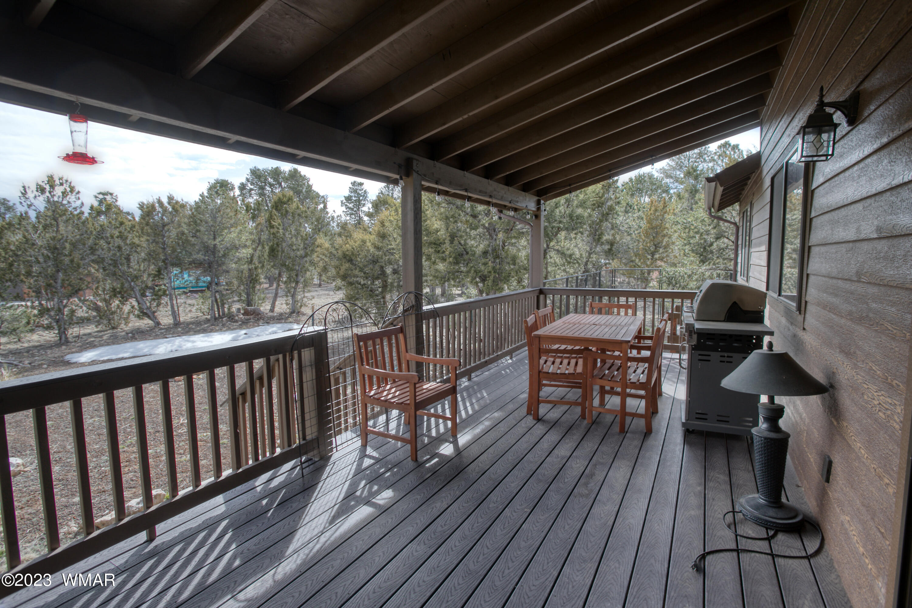 1979 Rim View Lane Heber, AZ 85928 - Photo 18 of 27 a view of a balcony with chairs and wooden floor